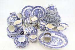A collection of 'Old Willow' pattern tea and dinner services.