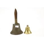 Two vintage bells. Including a 'school' hand bell stamped 'R.WELLS' on the interior, H28.