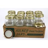 A collection eleven vintage glass Kilner storage jars .