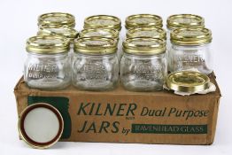 A collection eleven vintage glass Kilner storage jars .