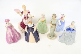 Seven ceramic figures of ladies.