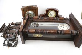 A vintage Vienna style wall clock and two mantle clocks.