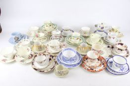 A collection of 19th century and later cups and saucers and trios.