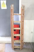 A three section wooden ladder.