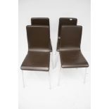 Set of four contemporary dining chairs with chrome legs.