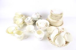 A collection of three vintage floral tea services.