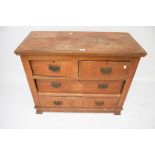 An Edwardian stained pine chest of drawers.