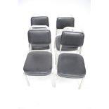 A set of four American style chairs.