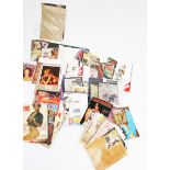 An assortment of vintage erotic collectables. Including calendars, magazines, glazed prints, etc.