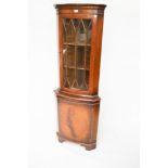 A 20th century mahogany Georgian style corner display cabinet.