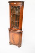 A 20th century mahogany Georgian style corner display cabinet.