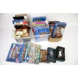 A large collection of jigsaw puzzles, toys and board games.