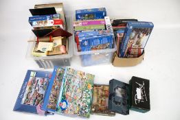 A large collection of jigsaw puzzles, toys and board games.