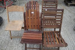 Five wooden folding garden chairs.