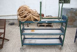 A wooden trolley, length of rope and a garden kneeler.