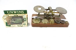 A vintage set of scales, a LLedo diecast model and a silver spoon.