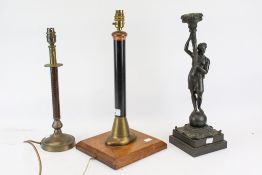 Three assorted table lamp bases. Including a pub beer pump pull, a weighted spelter figure, etc.