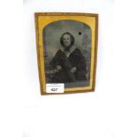 A Victorian Ambrotype studio photograph of a lady in a gilt metal frame. H17cm, AF.