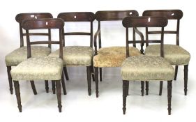 A set of five wooden framed upholstered dining chairs and a matching carver.