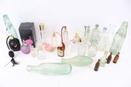 A collection of assorted vintage glass bottles. Including perfume, Codd 'Frome Mineral Water Co.