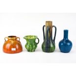 A collection of four assorted vintage pottery vases.