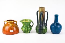 A collection of four assorted vintage pottery vases.