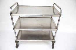 A stainless steel three tier trolley.