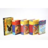 A collection of five assorted Harry Potter books.