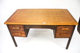 A mid century oak kneehole desk, by Abbes.
