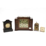 An oak cased mantle clock plus three others. Including a 1930s German H.A.C.