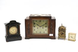 An oak cased mantle clock plus three others. Including a 1930s German H.A.C.