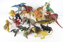 A large collection of assorted model dinosaurs and animals.