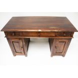 A contemporary hardwood twin pedestal desk.