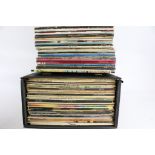 A collection of assorted vinyl 33 RPM LP records.
