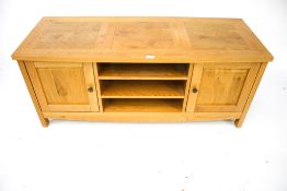 A contemporary pine television cabinet.