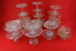 A large collection of 19th century and later glass cake stands.