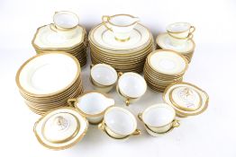 A Noritake tea and dinner service. Guilt decoration, plates and cups, etc.