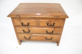 A vintage pine box with faux drawers.