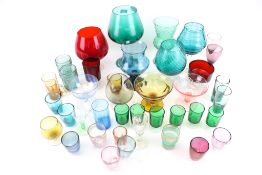 An assortment of vintage and later coloured glassware.