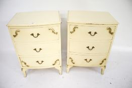 A pair of wooden bow fronted bedside cabinets.