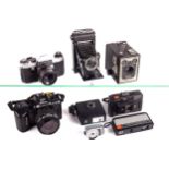 A collection of cameras and accessories.