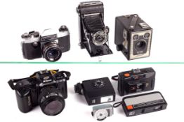 A collection of cameras and accessories.