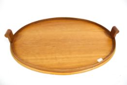 Vintage Retro : A mid-century Scandinavian birch wood oval tray with shaped handles. H3cm x W60.