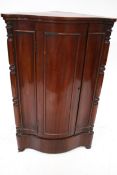A 19th century mahogany corner cabinet.
