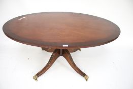 A 20th century mahogany coffee table.