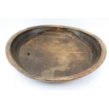 An antique oak bowl.