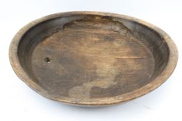 An antique oak bowl.