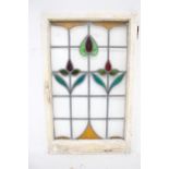 An Arts and Crafts leaded and stained glass window pane.