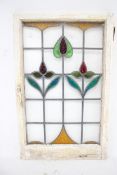 An Arts and Crafts leaded and stained glass window pane.