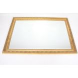 A contemporary bevelled edge gilt framed mirror.